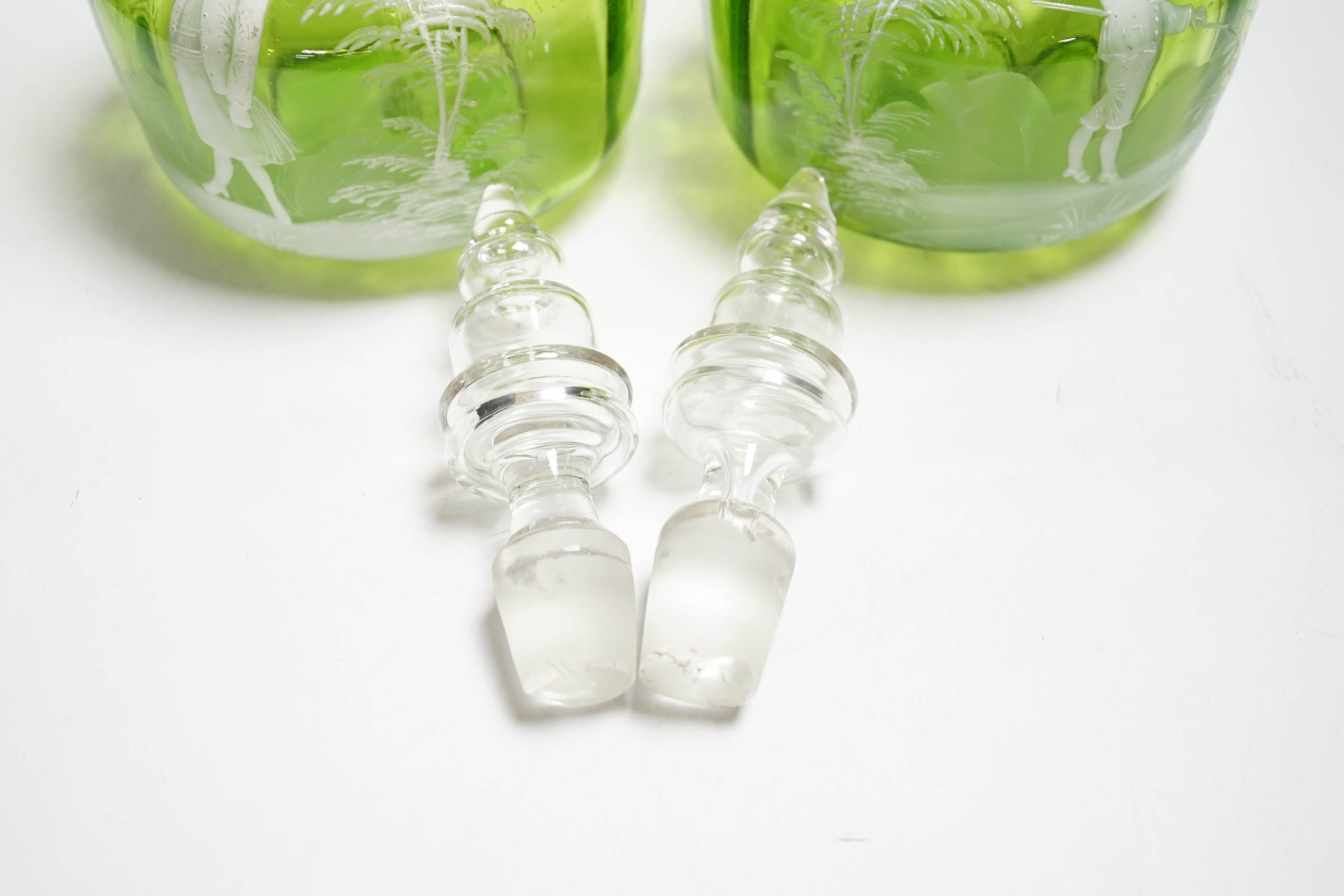 A pair of Mary Gregory glass decanters and stoppers, 26cm